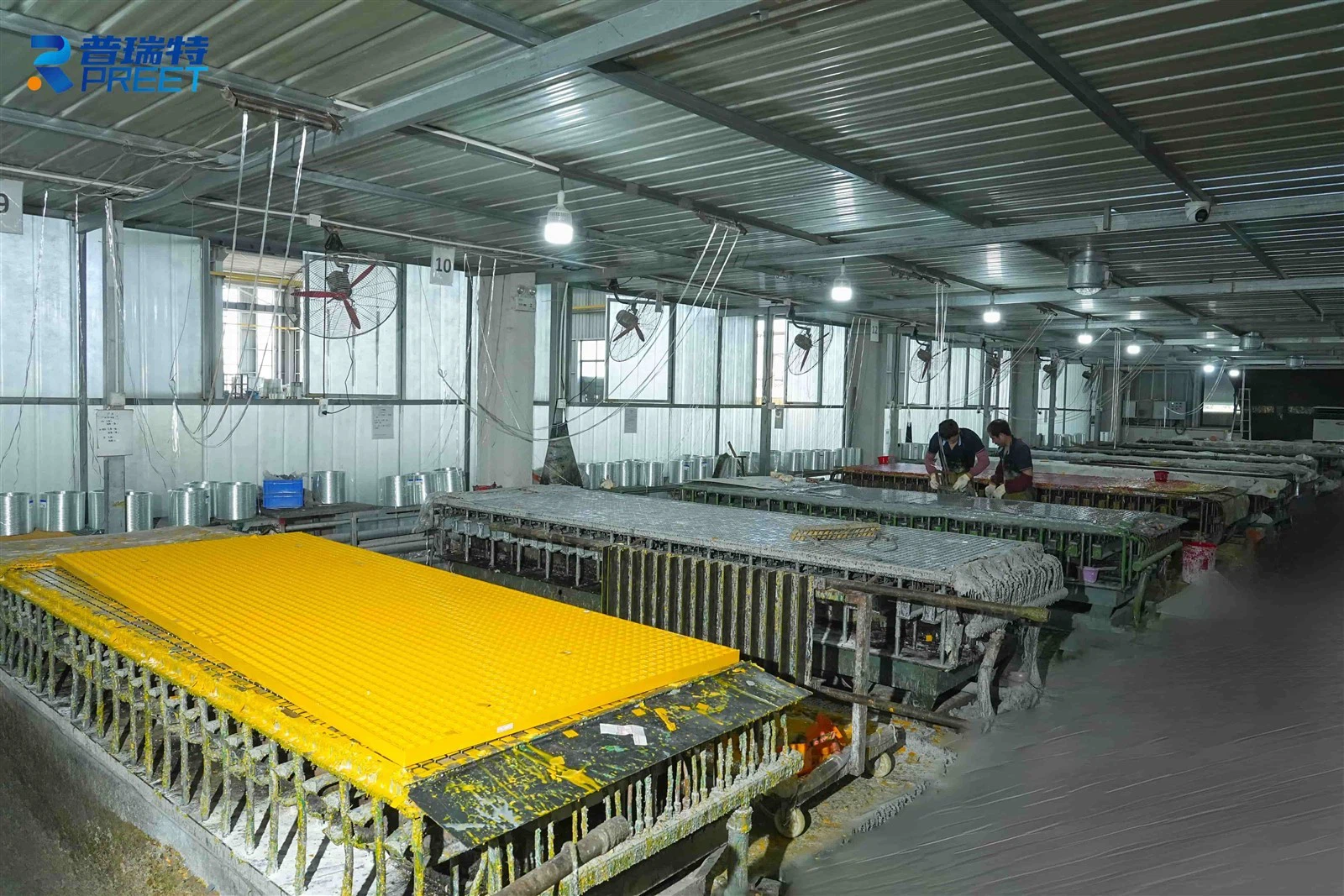 FRP grating factory workshop showing molded and pultruded grating production lines in China FRP grating factory workshop showing molded and pultruded grating production lines in China